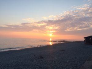 Pink-orange sunset over Aberystwyth's South Beach