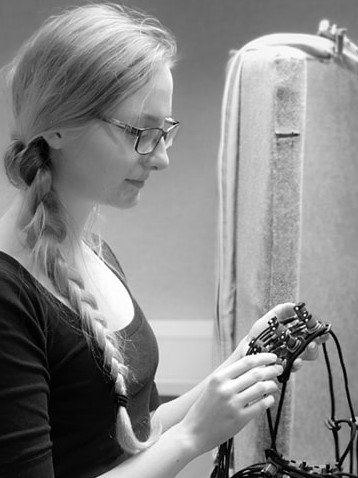 Sammi attaching wires to a head cap