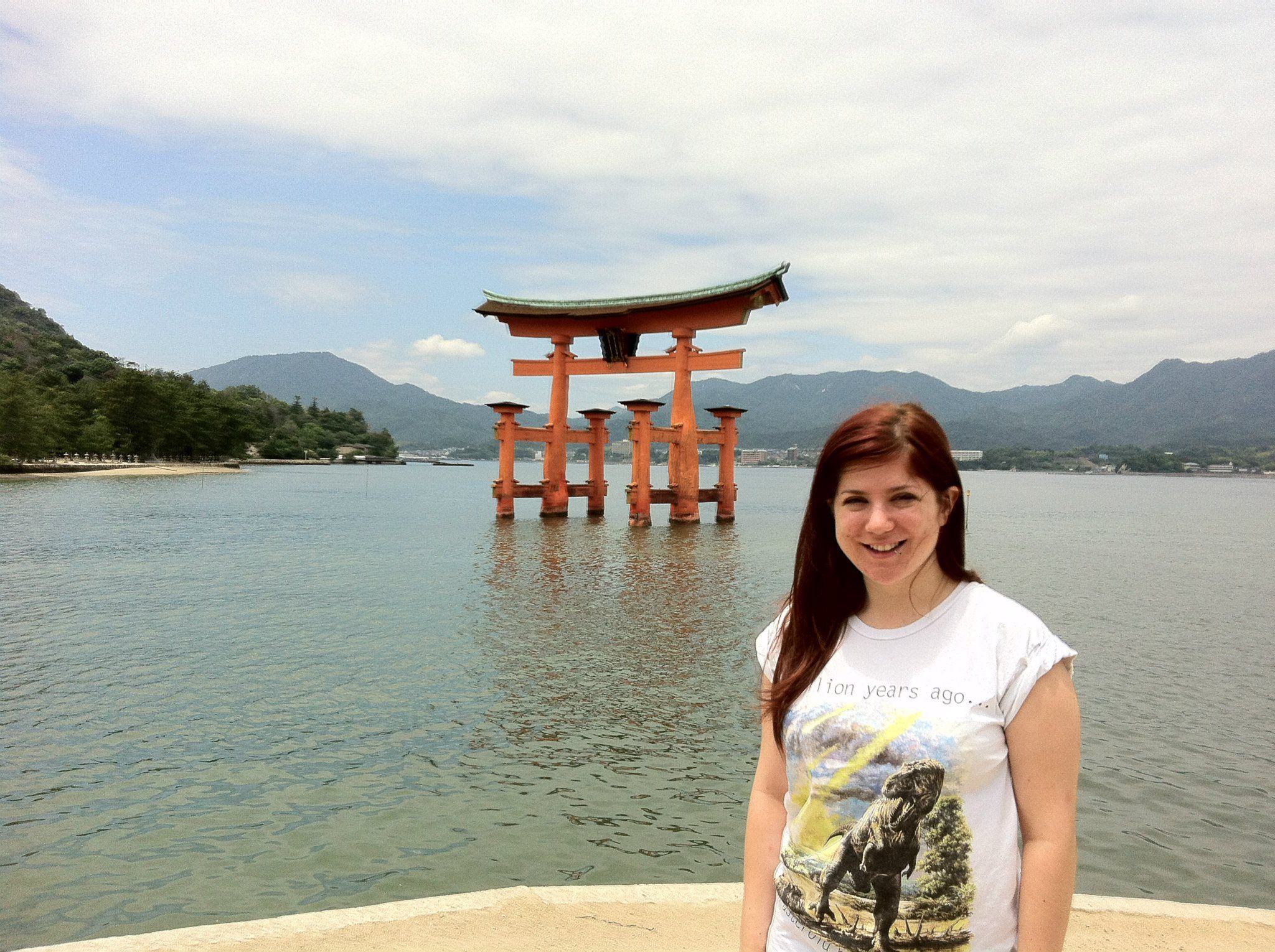 Olly stood in front of a Japanese Torii gate - torii gates are the entrances into Shinto shrines