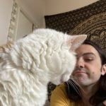 James posing with his cat Walter