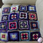 Quilt I am working on, laid out on the sofa