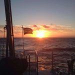 Sunset over the sea with a corner of the Spanish coastal research vessel, RV Socib in the foreground