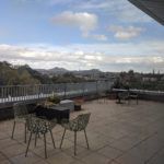 A view of the Edinburgh skyline from a large roof terrace