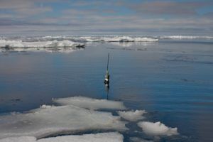 Argo float floating in the sea surrounded by sea ice