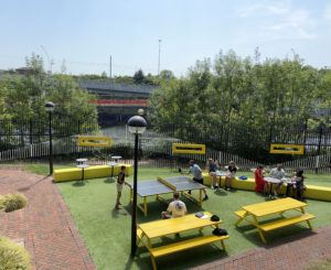 View from my office. Canal and people playing table tennis in the grass